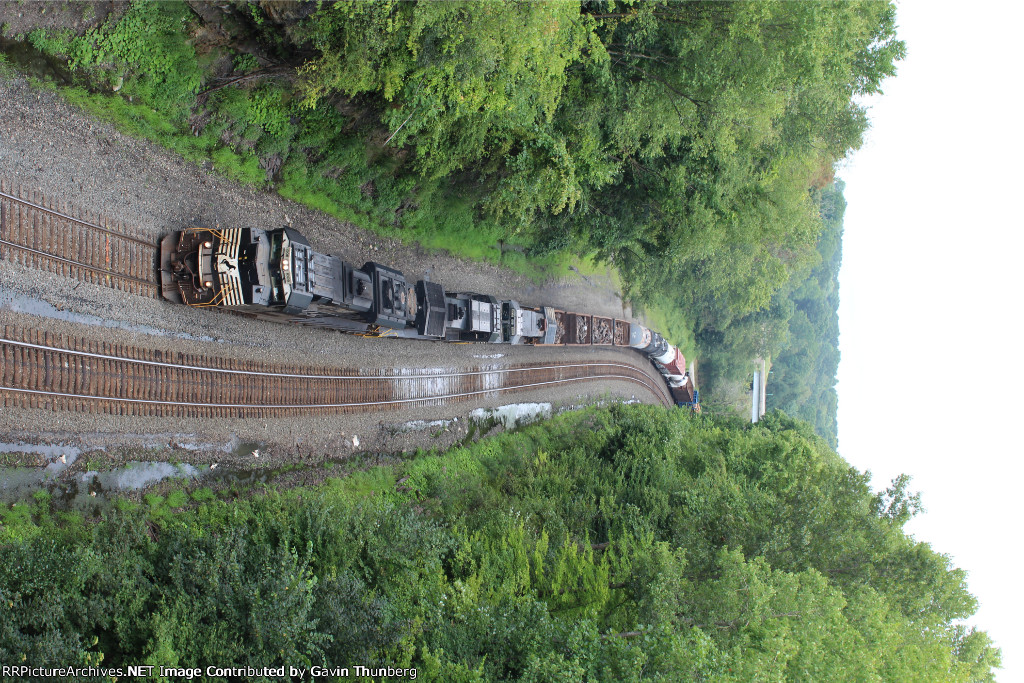 An NS freight slowly rolls up the grade at Summit Cut